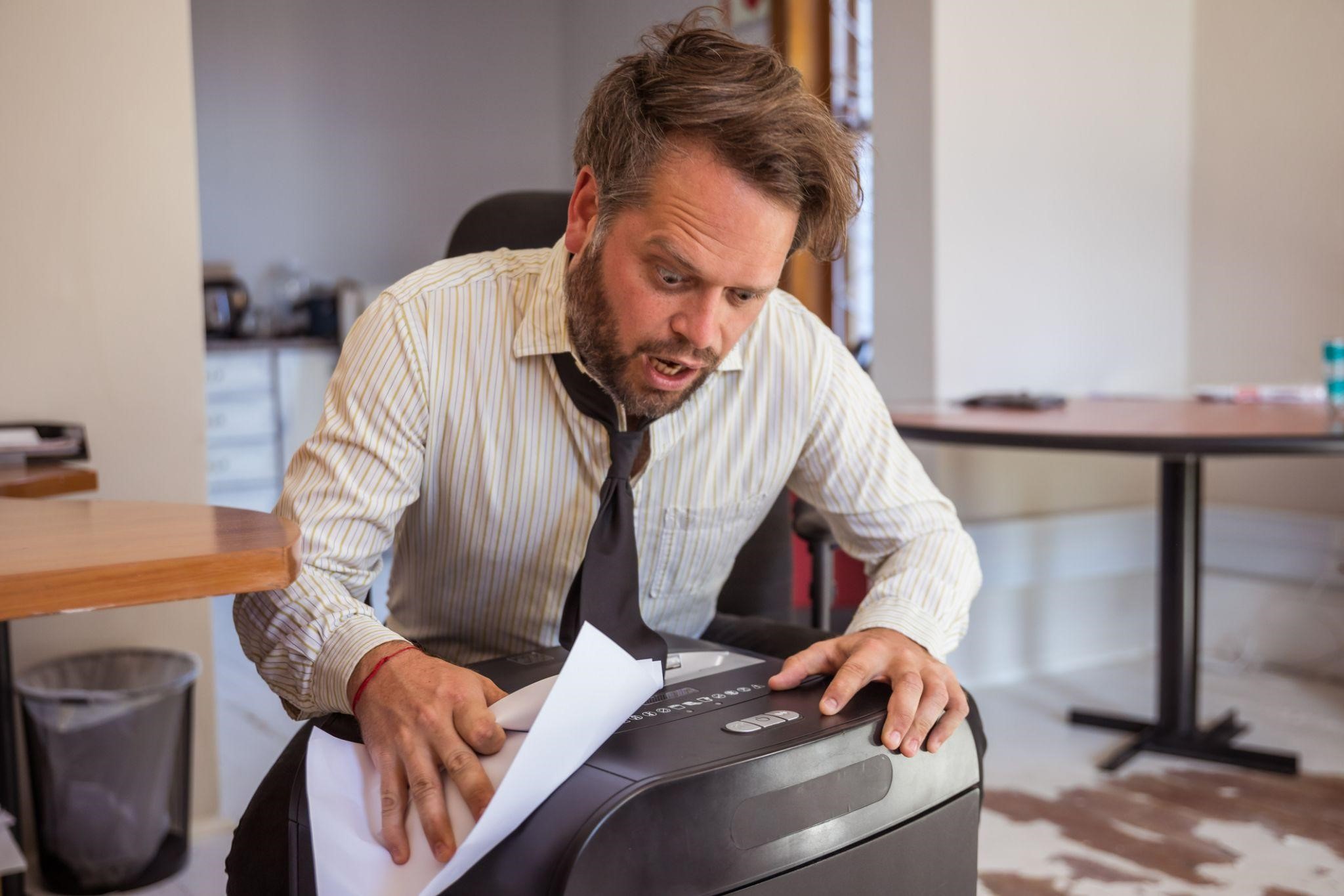 shredding confidential documents in the office