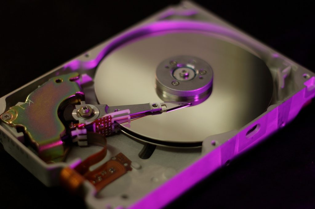 a hard drive with a purple light shining on it.