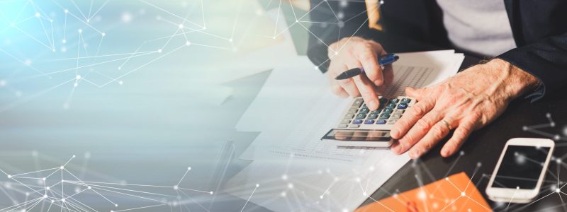 Hand using calculator, accounting concept; panoramic banner